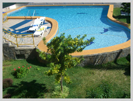 The exterior of the villa and the swimming pool